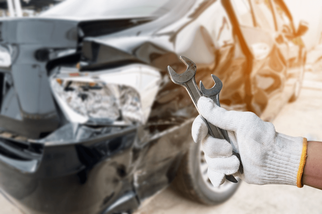 Technician completing smash repairs on a vehicle in Rydalmere